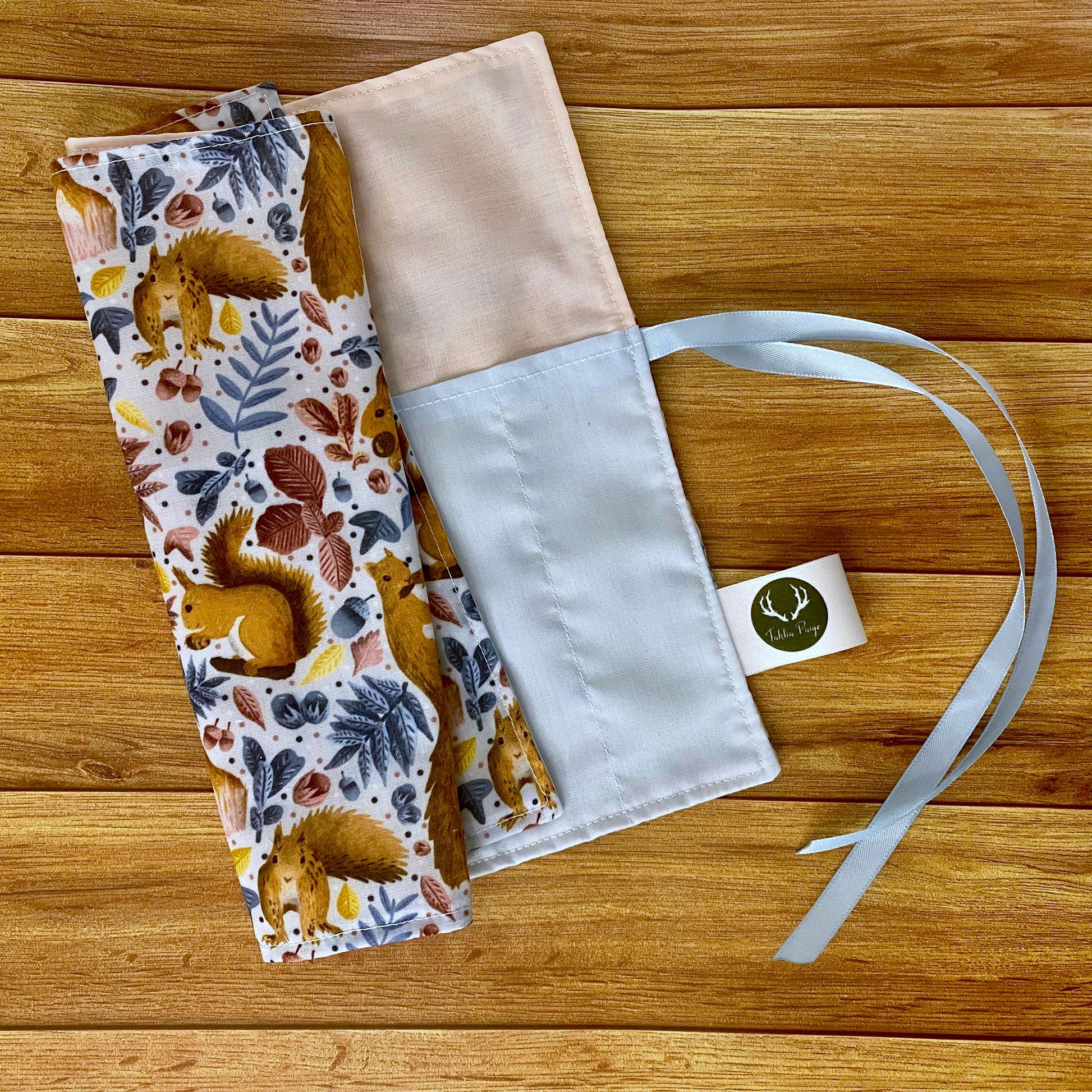 ideal gift for a red squirrel lover, our red squirrel roll up brush wrap here with blue lining