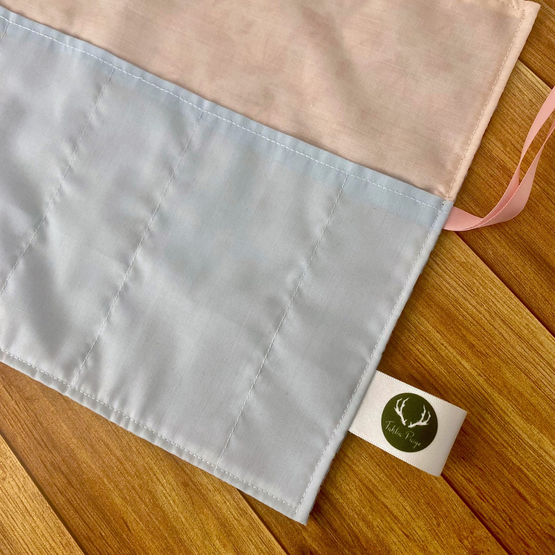 a great gift for an artist, a closeup of the practical pockets for paintbrushes