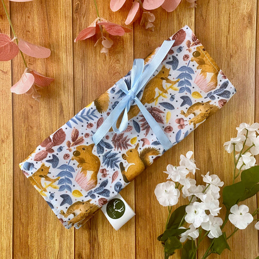 ideal red squirrel gift, our red squirrel roll up makeup bag is shown wrapped up here.