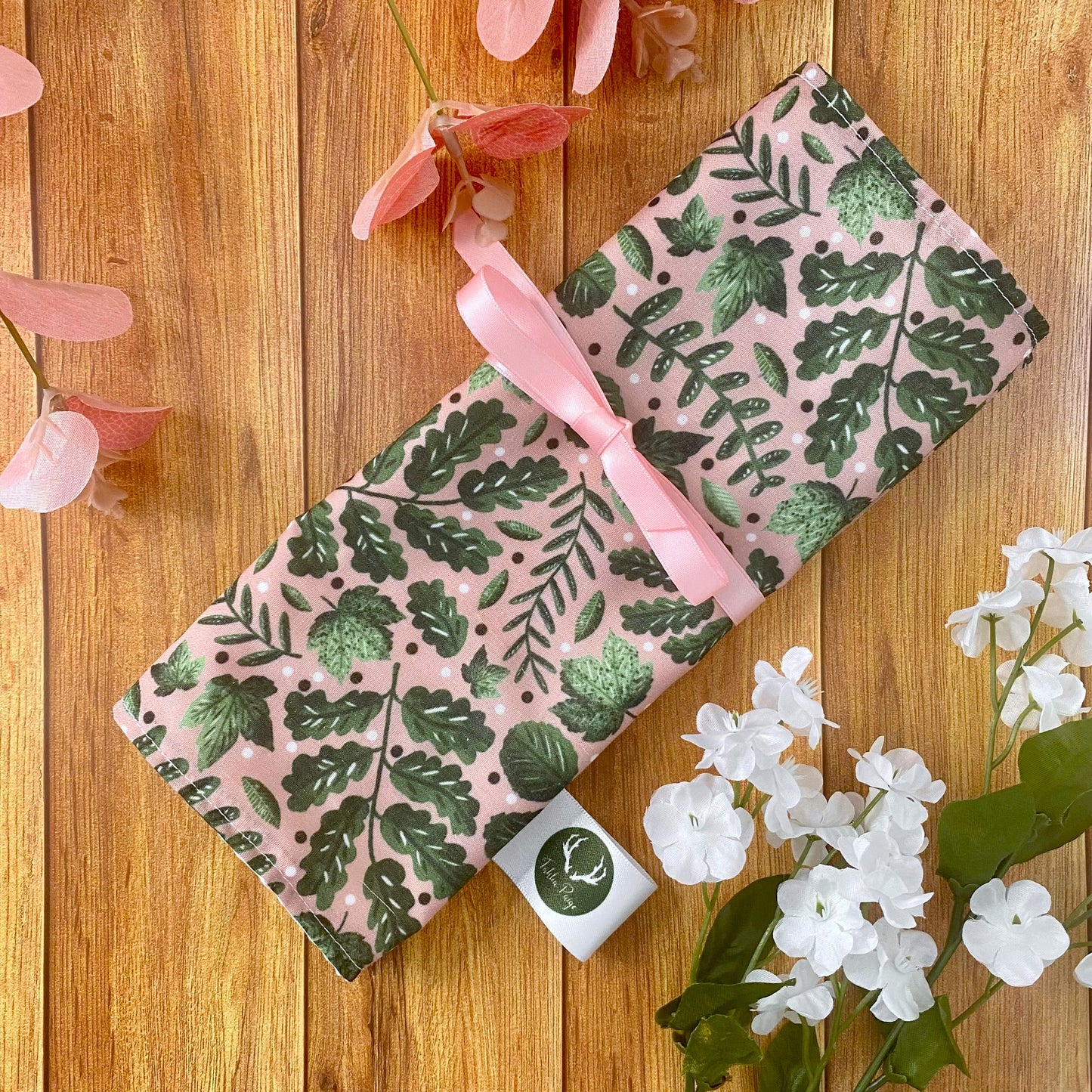 our makeup bag that opens flat to add makeup brushes in is a perfect gift for a nature lover, with a pink ribbon to keep it closed.