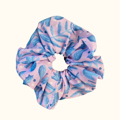 blue foliage pattern on a scrunchie shown on a white background