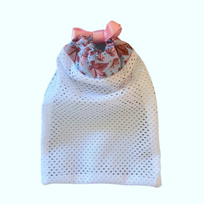 pink leafy washbag on a white background