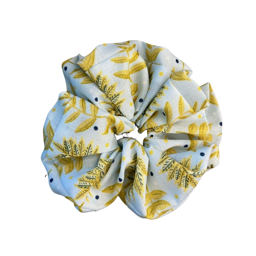 yellow foliage patterned scrunchie on white bacgkround