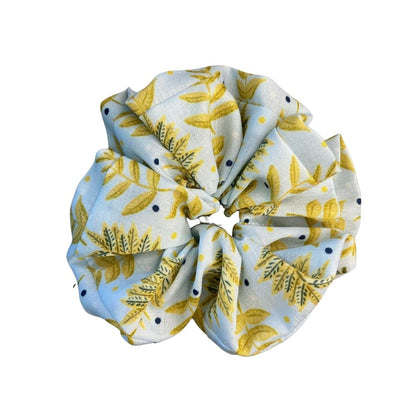 yellow foliage patterned scrunchie on white bacgkround
