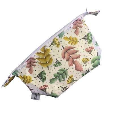 pretty foliage patterned makeup bag on white background