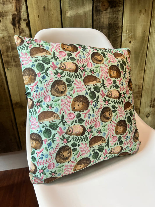 Our hedgehog cushion is a great decorative cushion for a bed or sofa, with a lovely hedgehog pattern on a green background. These hedgehog gifts are great as gifts for hedgehog lovers.