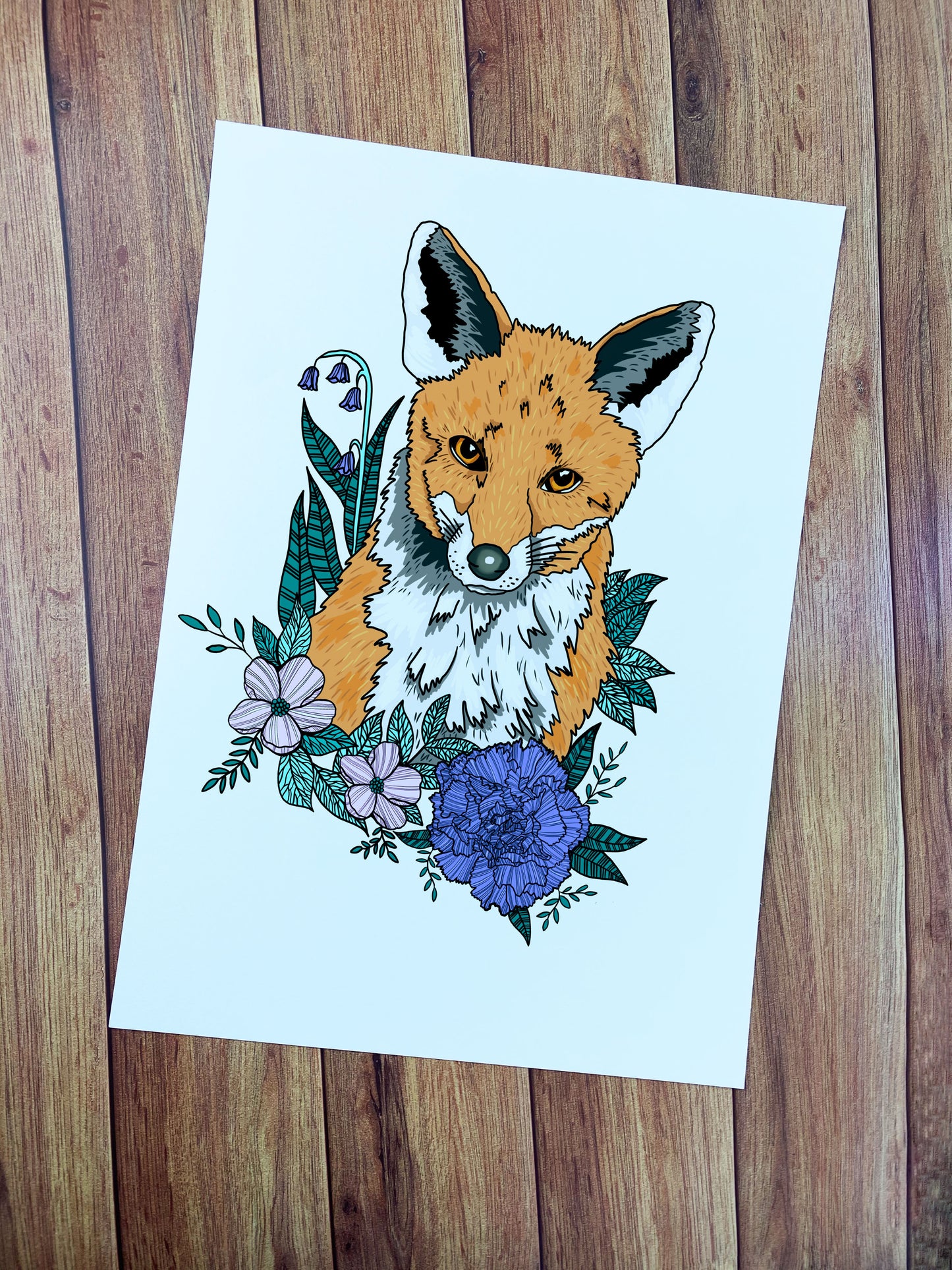 An a4 print art showing a fox and flowers around it. The a4 print is ideal for wall art in the living room or bedroom.