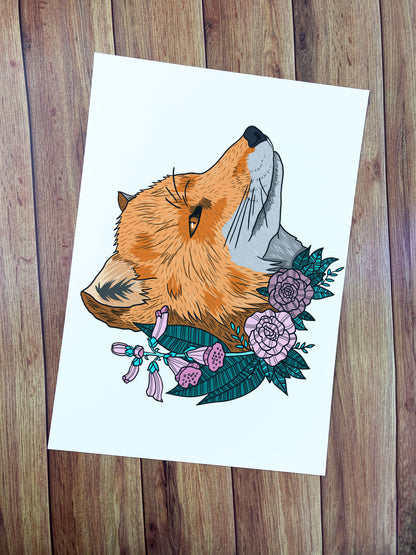 Fox print illustrated with bold lines and flowers surrounding a fox's head. It is coloured in and on a white background. This a4 art print is ideal as wall decor around the home.