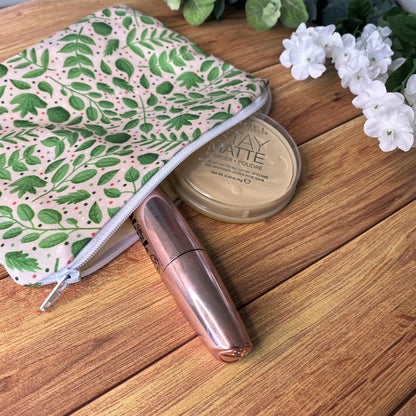 our cute cosmetic bag here with a green leafy pattern is ideal for someone going travelling to store essentials in the handbag.