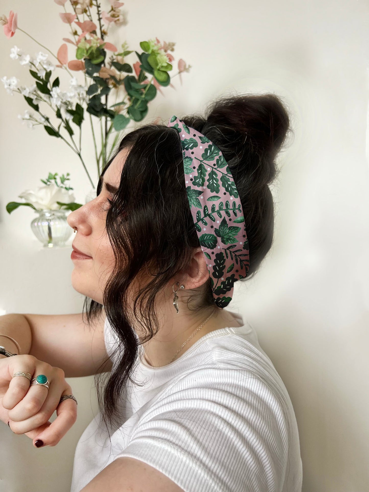 green foliage patterned headband on dark haired girl. shop gifts just because for her with this cute headband look.