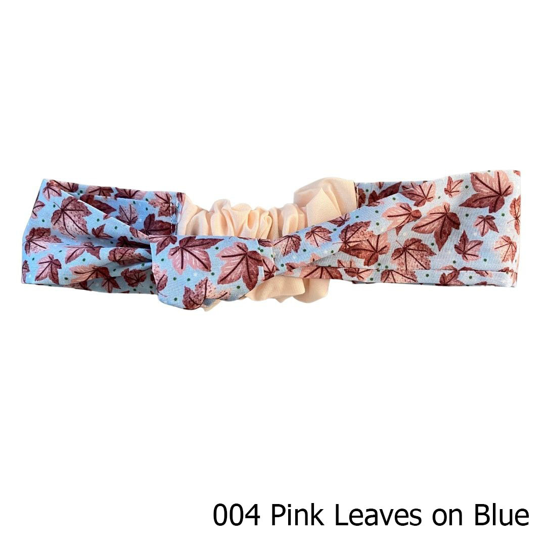 pink leafy patterned headband on white background
