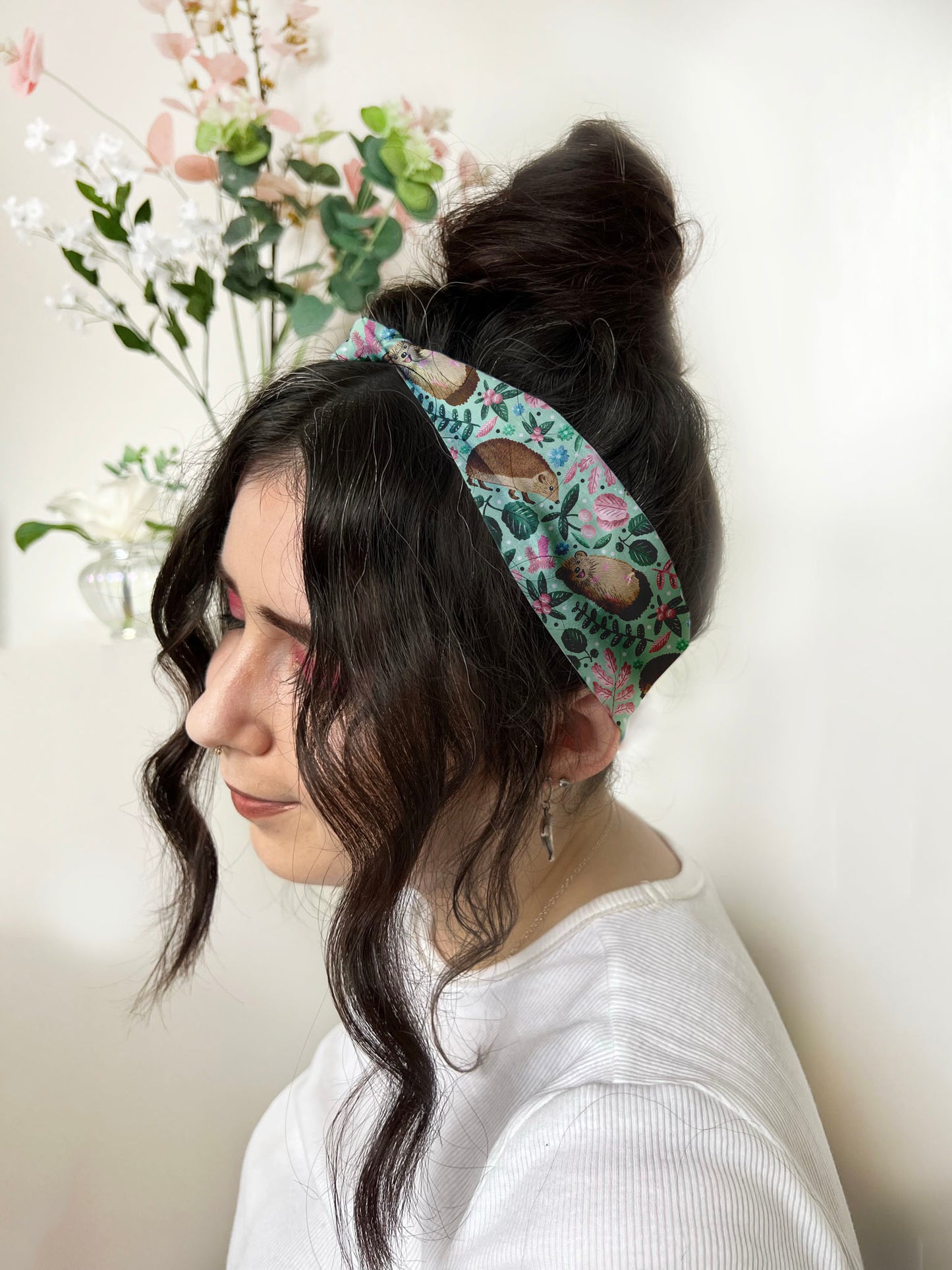 dark haired girl wears hedgehog headband, a cute hedgehog hair accesssories