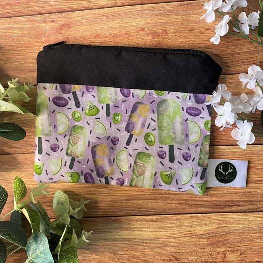 A gorgeous summer pattern on a small coin purse, ideal for a handmade gift for her as something small with a purple pattern.