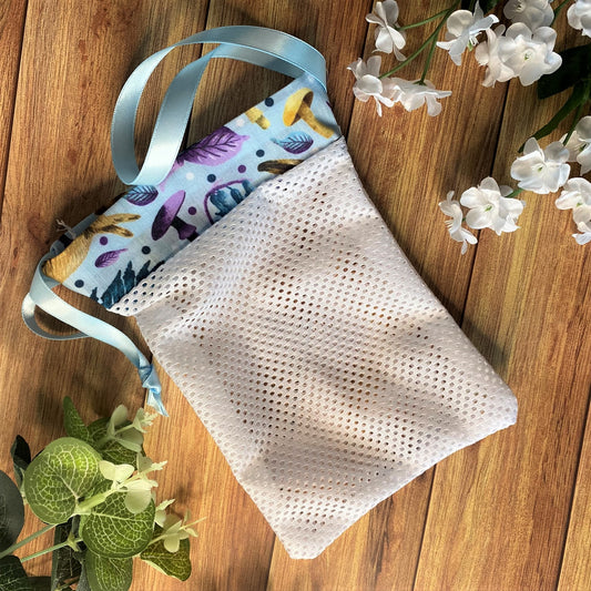 hare patterned washbag on a wooden background