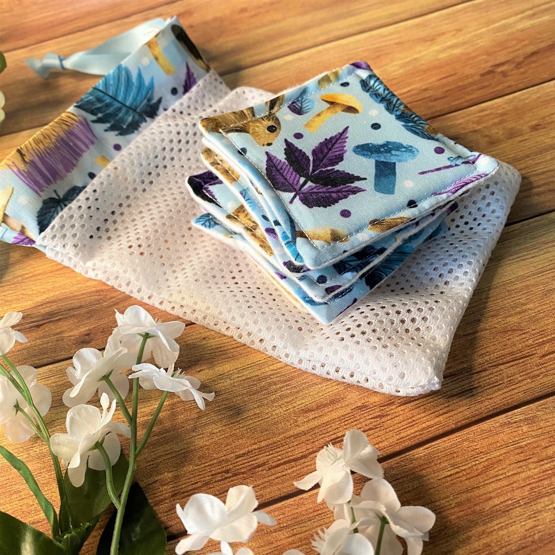 hare patterned reusable makeup removal pads and a washbag matching, on a wooden surface